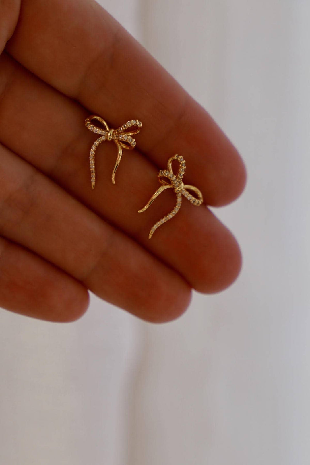 E1691G Gold Earrings-CZ Bow Studs