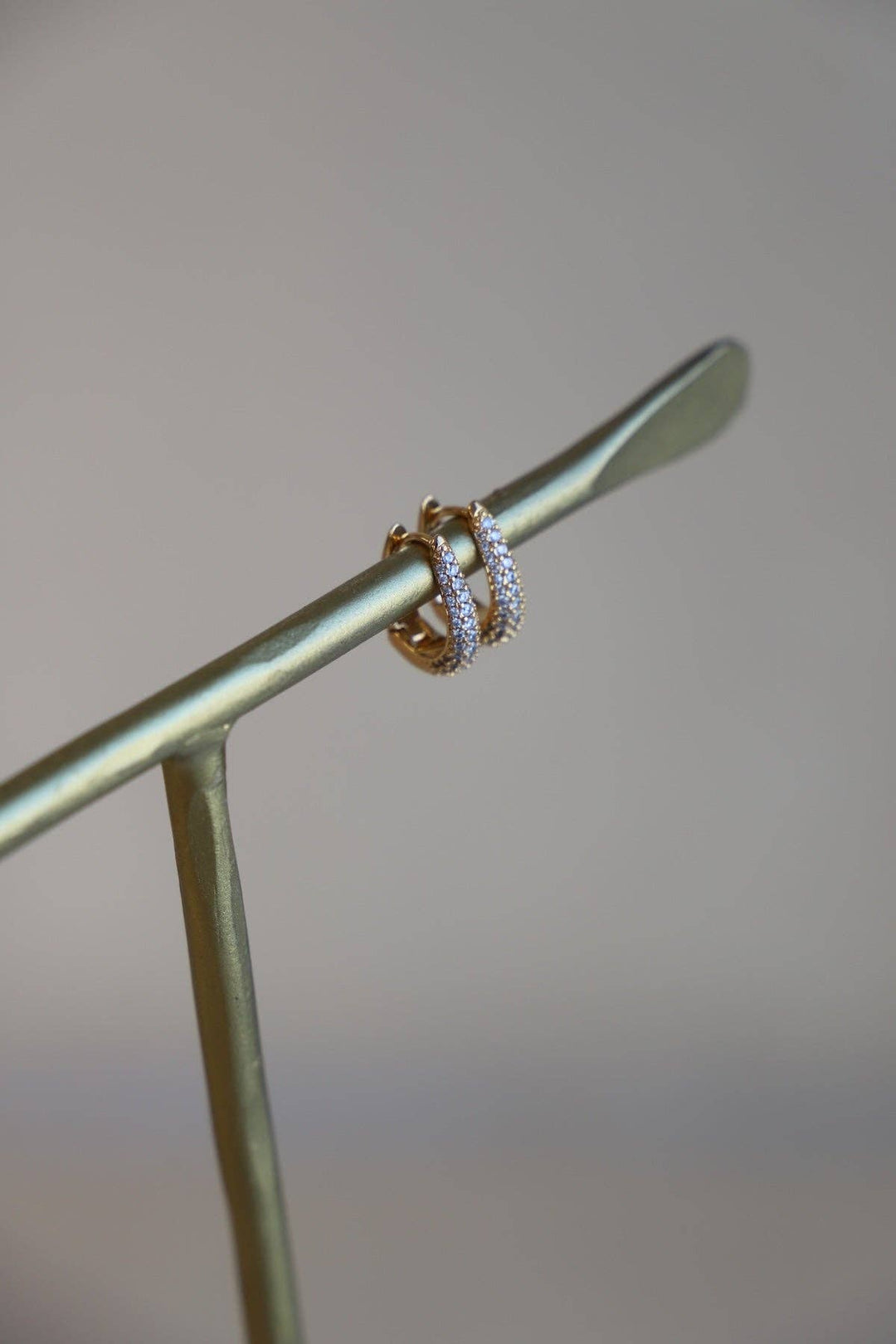 E1679 Gold Earrings-Oval CZ Huggie Hoops