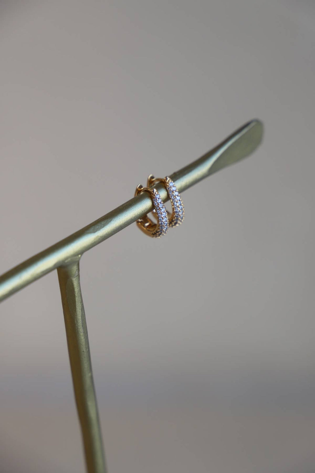 E1679 Gold Earrings-Oval CZ Huggie Hoops