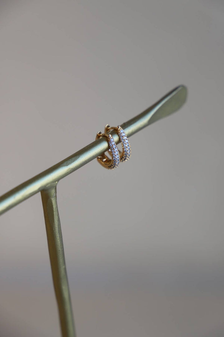E1679 Gold Earrings-Oval CZ Huggie Hoops