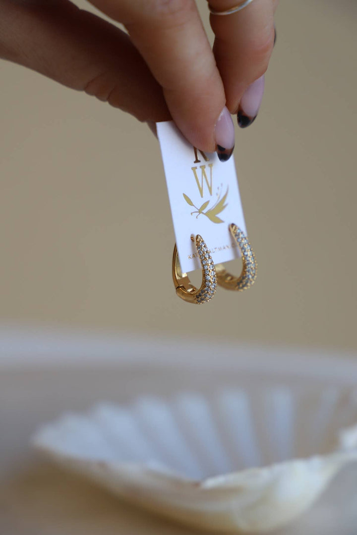 E1679 Gold Earrings-Oval CZ Huggie Hoops